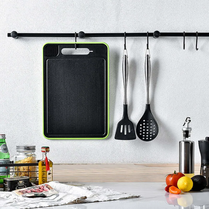 Double-sided cutting board with defrost function and knife sharpener