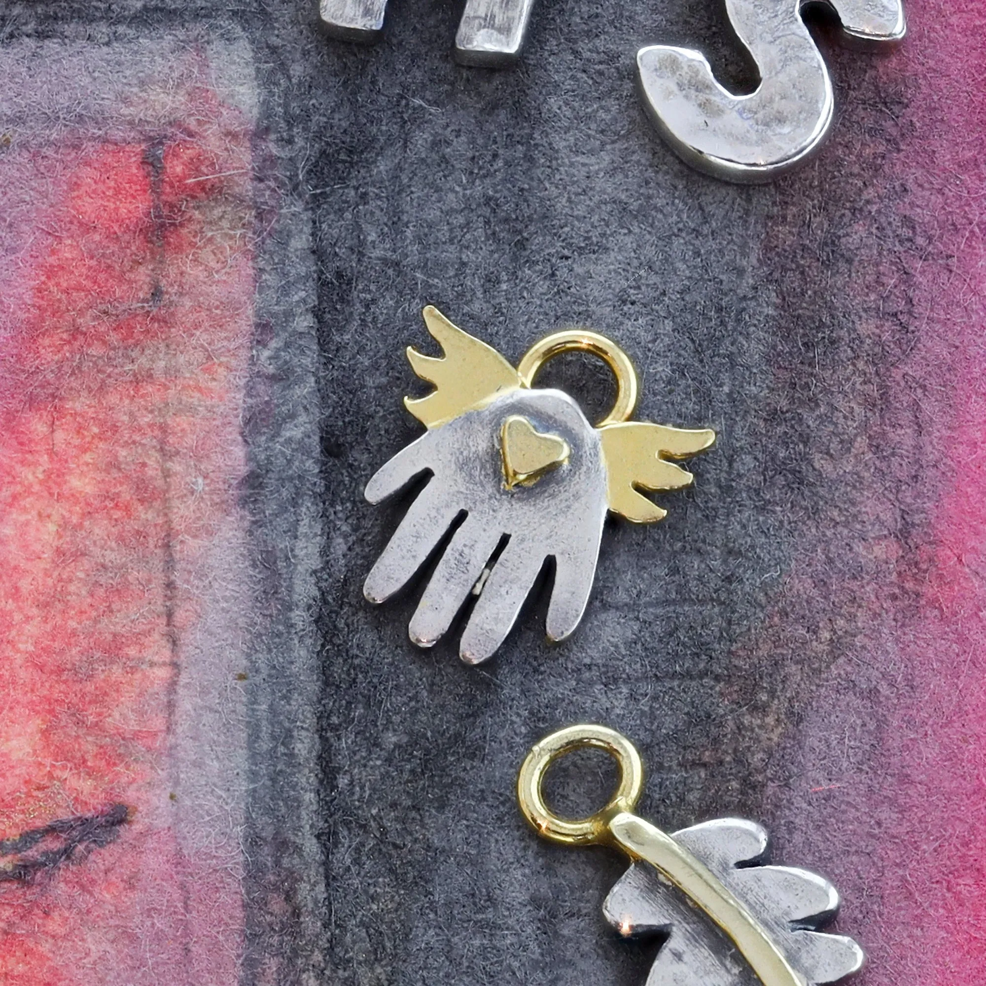 Little Winged Hand Charm